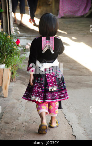 Children Ethnic Hmong wear costume traditional and playing with friends at Doi Pui Tribal Village and National Park on December 28, 2016 in Chiang Mai Stock Photo