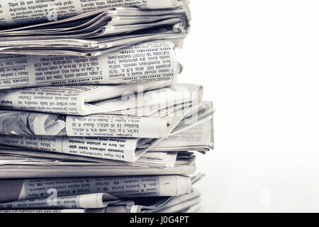 closeup stack of old newspapers Stock Photo