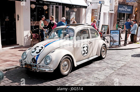 Old Volkswagen Beetle car painted in same colours as from the famous film Herbie spotted parked in Brighton UK Stock Photo