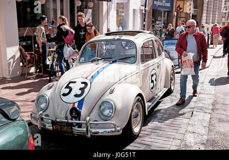 Old Volkswagen Beetle car painted in same colours as from the famous film Herbie spotted parked in Brighton UK Stock Photo