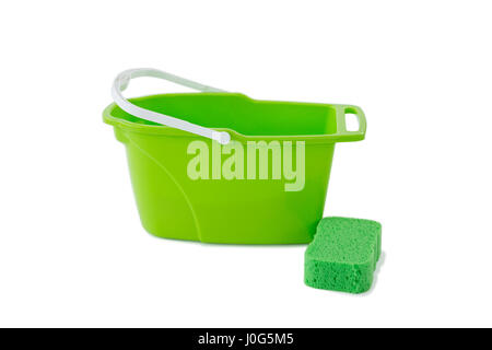 Close-up of green bucket with cleaning sponge against white background Stock Photo