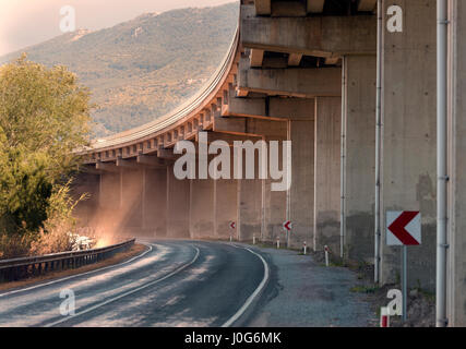 Road and bridge with dust and lightrays Stock Photo