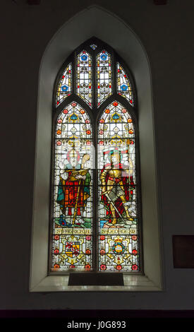 Stained glass window depicting St. Patrick and St. George in the Church of St. Barrahane, Castletownsend, County Cork, Ireland Stock Photo