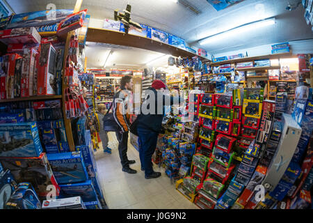 Customers buying model toys in  'The Albatross' traditional old-fashioned  toy, hobby  and model shop, Aberystwyth Wales UK Stock Photo