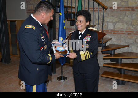U.S. Army Col. Darius S. Gallegos, CoESPU deputy director (left), presents Carabinieri CoESPU crest to Admiral Michelle Howard, NATO JFC-Naples Commander, during the visit at the Center of Excellence for Stability Police Units (CoESPU) Vicenza, April 10, 2017. (U.S. Army Photo by Visual Information Specialist Paolo Bovo/released)