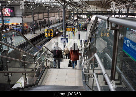 Leeds City Railway Station, Leeds, West Yorkshire, UK, with Sprinter train to Manchester waiting at platform Stock Photo