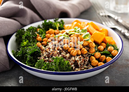 Green and healthy grain bowl with roasted chickpeas Stock Photo