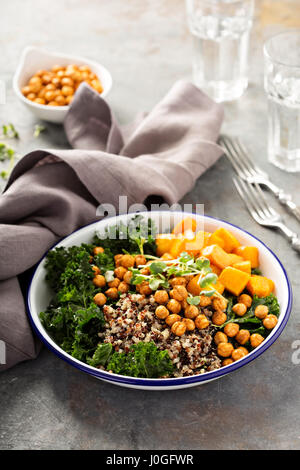 Green and healthy grain bowl with roasted chickpeas Stock Photo