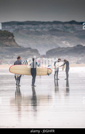 Gwithian Towans beach Surfers Longboards Surfboards Walking Leisure activity Coast Coastal scene Cornwall Stock Photo