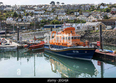 RNLI Penlee Lifeboat RNLB Ivan Ellen Severn Class Moored Newlyn Fishing Port Harbour Harbor Fishing boats Coast Coastal scene Town Houses Stock Photo