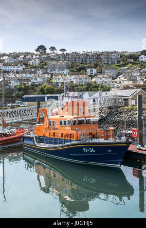 RNLI Penlee Lifeboat RNLB Ivan Ellen Severn Class Moored Newlyn Fishing Port Harbour Harbor Fishing boats Coast Coastal scene Town Houses Stock Photo