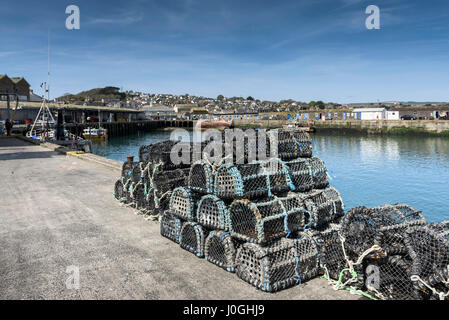 Newlyn Fishing Port Lobster pots Quayside Harbour Harbor Fishing industry Coast Coastal scene Cornwall Stock Photo