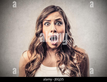 Brunette woman being scared Stock Photo