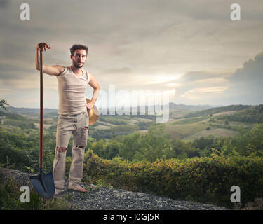 Man with shovel in the nature Stock Photo