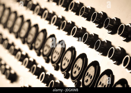 closeup of audio inputs on a soundboard mixer Stock Photo