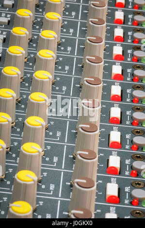 dials and led lights on a soundboard mixer Stock Photo