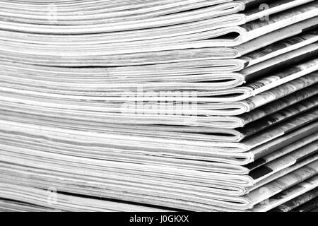 Stack of old colored magazines close-up. B&W Stock Photo