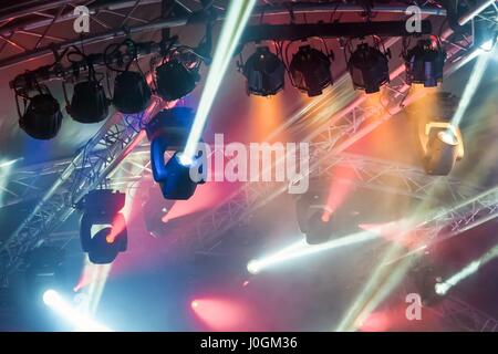 multiple spotlights on a theatre stage lighting rig Stock Photo