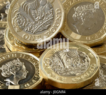 New £1 coin is 12 sided and is the most secure coin in the world - British new £1 coin is bimetallic with latent image that changes from £ symbol - 1h Stock Photo
