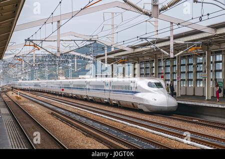 Shinkansen train pulls into Shin Osaka Station, Japan. Stock Photo