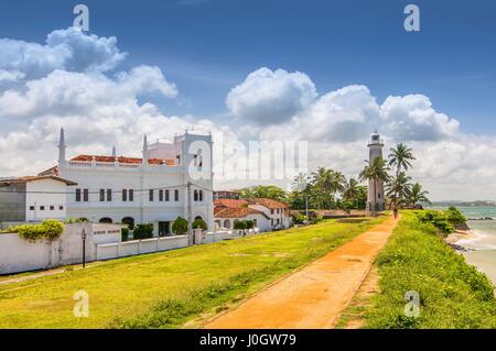 Meeran Jumma Mosque and the lighthouse at the Point Utrecht Bastion in the old Dutch Fort, Galle, Southern Province, Sri Lanka Stock Photo