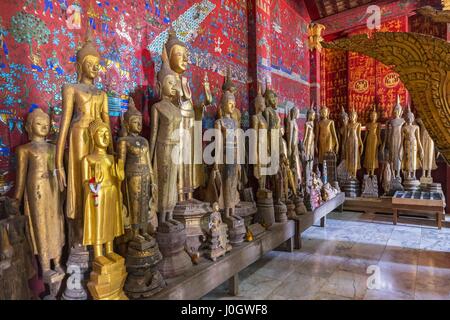 Buddha statues in the Funerary Carriage Hall, Wat Xieng Thong, Luang Prabang, Laos, Indochina, Asia Stock Photo