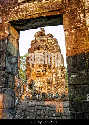 The Bayon is a well-known and richly decorated Khmer temple at Angkor in Cambodia. Built in the late 12th century or early 13th century as the officia Stock Photo