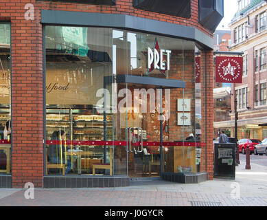 Exterior shot of the of the coffee shop cafe Pret a Manger, in the city centre of Manchester, showing the interior displays + customers drinking. Stock Photo