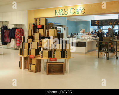 Interior of the Manchester branch of department store Marks & Spencer shop shops in the city centre center showing a chocolate display and the cafe. Stock Photo