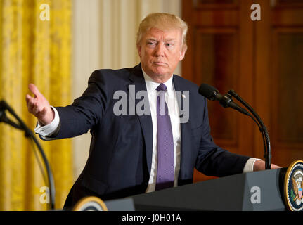 Washington DC, USA. 12th Apr, 2017. United States President Donald J. Trump conducts a joint press conference with Secretary General Jens Stoltenberg of NATO in the East Room of the White House in Washington, DC on Wednesday, April 12, 2017. Credit: Ron Sachs/CNP /MediaPunch Credit: MediaPunch Inc/Alamy Live News Stock Photo