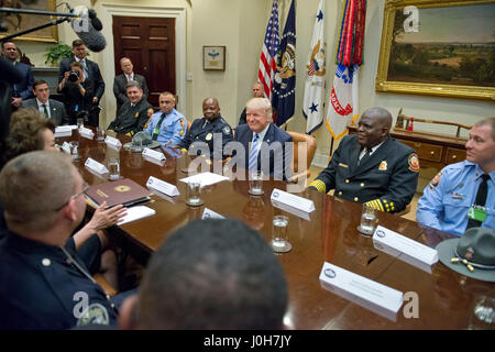 Washington, USA. 13th Apr, 2017. United States President Donald J. Trump meets with the I-85 bridge first responders in the Roosevelt Room of the White House in Washington, DC on Thursday, April 13, 2017. Credit: MediaPunch Inc/Alamy Live News Stock Photo