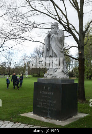 Berlin. 13th Apr, 2017. Photo taken on April 13, 2017 shows a statue of Confucius by the Chinese garden 'De Yue Yuan' at the Gardens of the World in eastern Berlin, capital of Germany. Credit: Shan Yuqi/Xinhua/Alamy Live News Stock Photo