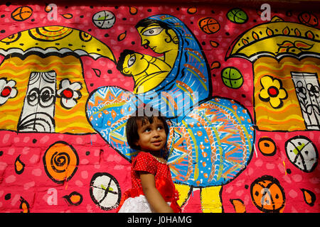 Dhaka, Bangladesh. 14th Apr, 2017. A child sit in front of a painted wall at the Fine Arts Faculty of Dhaka University as the pert of the Bangla new year celebration. Credit: Muhammad Mostafigur Rahman/Alamy Live News Stock Photo