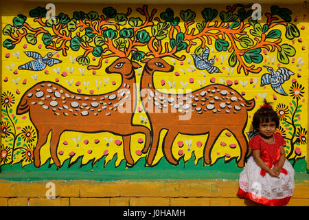 Dhaka, Bangladesh. 14th Apr, 2017. A child sit in front of a painted wall at the Fine Arts Faculty of Dhaka University as the pert of the Bangla new year celebration. Credit: Muhammad Mostafigur Rahman/Alamy Live News Stock Photo