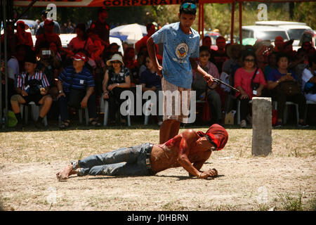 Philippines. 14th Apr, 2017. Hundreds of penitents walked under the midday sun in San Fernando, Pampanga, during the annual Good Friday Maleldo festival as they sacrifice their body for their faith. Flagellation and crucifixion has been discouraged by the Catholic church but devotees have continued the tradition for decades. Credit: J Gerard Seguia/ZUMA Wire/Alamy Live News Stock Photo