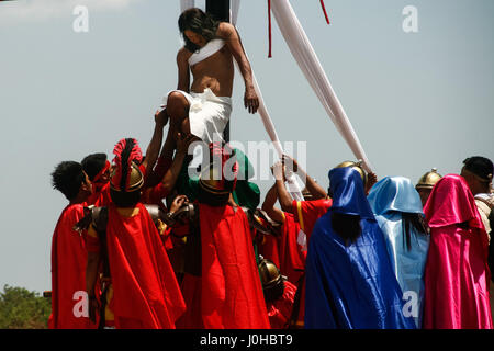 Philippines. 14th Apr, 2017. Hundreds of penitents walked under the midday sun in San Fernando, Pampanga, during the annual Good Friday Maleldo festival as they sacrifice their body for their faith. Flagellation and crucifixion has been discouraged by the Catholic church but devotees have continued the tradition for decades. Credit: J Gerard Seguia/ZUMA Wire/Alamy Live News Stock Photo