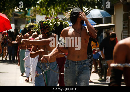 Philippines. 14th Apr, 2017. Hundreds of penitents walked under the midday sun in San Fernando, Pampanga, during the annual Good Friday Maleldo festival as they sacrifice their body for their faith. Flagellation and crucifixion has been discouraged by the Catholic church but devotees have continued the tradition for decades. Credit: J Gerard Seguia/ZUMA Wire/Alamy Live News Stock Photo