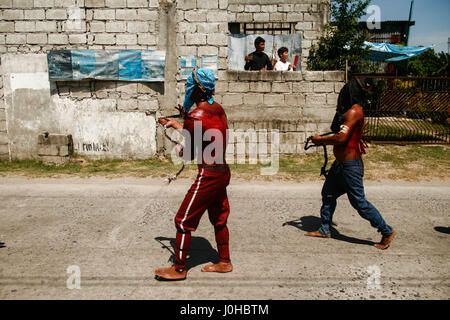 Philippines. 14th Apr, 2017. Hundreds of penitents walked under the midday sun in San Fernando, Pampanga, during the annual Good Friday Maleldo festival as they sacrifice their body for their faith. Flagellation and crucifixion has been discouraged by the Catholic church but devotees have continued the tradition for decades. Credit: J Gerard Seguia/ZUMA Wire/Alamy Live News Stock Photo