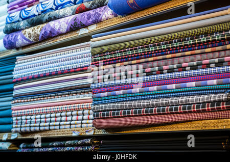 Fabrics for sale on the old Bazaar of Kashan city, capital of Kashan County in Iran Stock Photo
