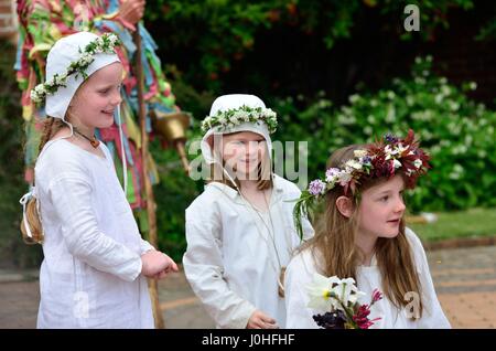 Kentwell Hall England, United Kingdom - May 05, 2014: Three young girls in costume enjoying May day Stock Photo