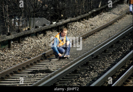 Railway accident investigator checking the track after the Purley station rail crash in Surrey Uk 5th March 1989 Stock Photo