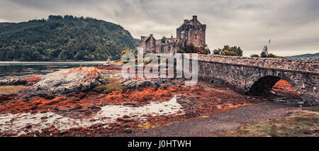 Sunset over lake at Eilean Donan Castle in Scotland Stock Photo