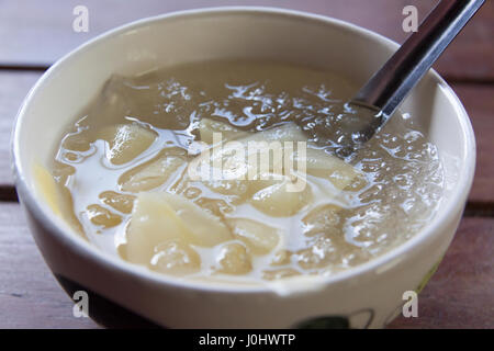 Traditional thai dessert, mango in syrup and ice Stock Photo