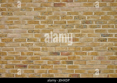 Brick wall construction demonstrating one of a number of brick wall types in red yellow brown and white Stock Photo