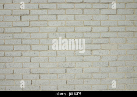 Brick wall construction demonstrating one of a number of brick wall types in red yellow brown and white Stock Photo