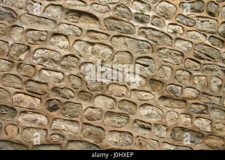 a picture or image of pointed stone work on a rock wall. Stock Photo