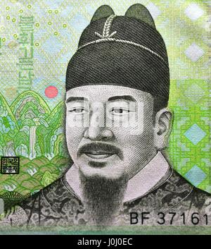 View on portion of the 10000 Won note showing of Sejong the Great with beard on green background Stock Photo
