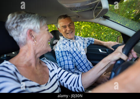Happy senior couple sitting in car Stock Photo