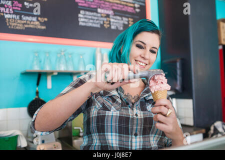 Young woman at ice cream shop Stock Photo