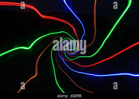 Multi-coloured light painting photography against a black background Stock Photo